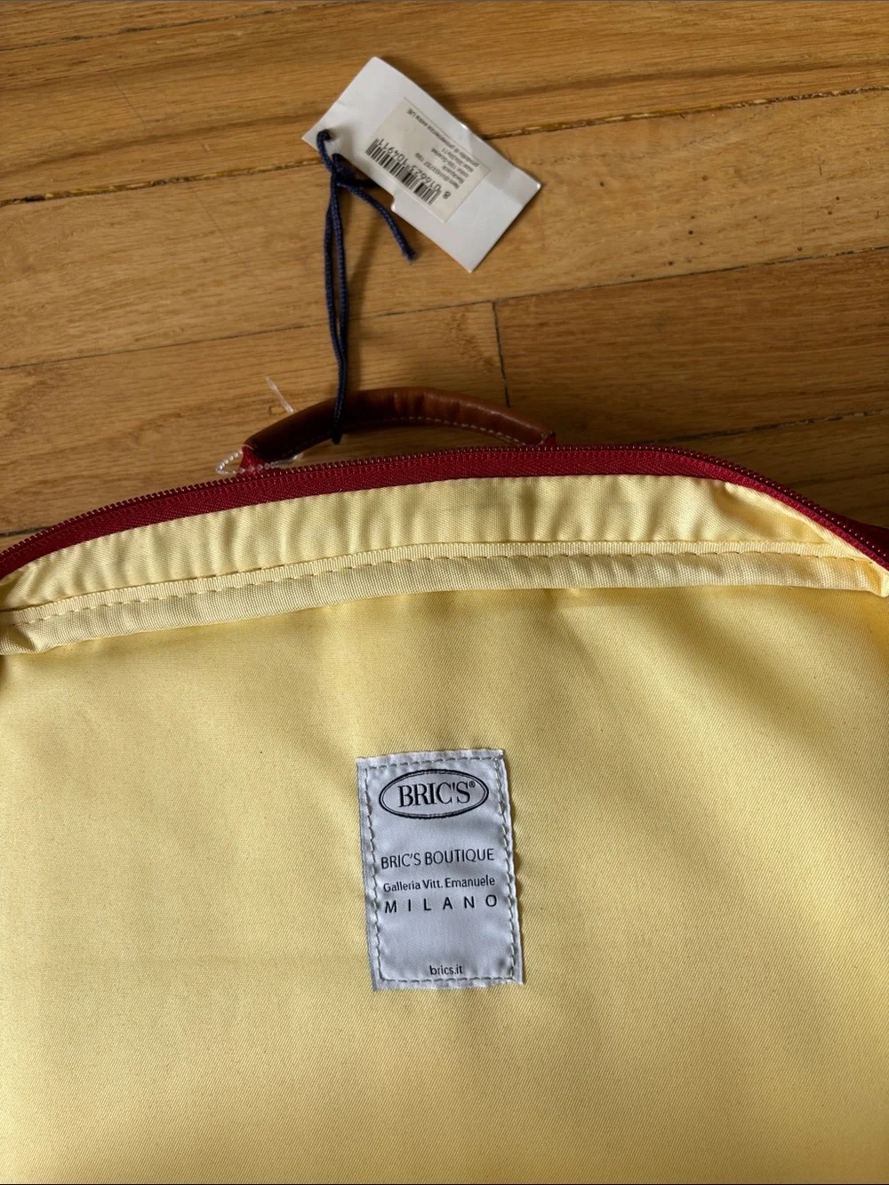 Bric's Red Pebbled Leather Backpack with Tan Accents